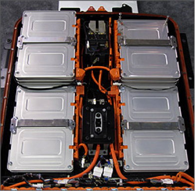 Photograph of a lithium ion vehicle battery with orange cabling.